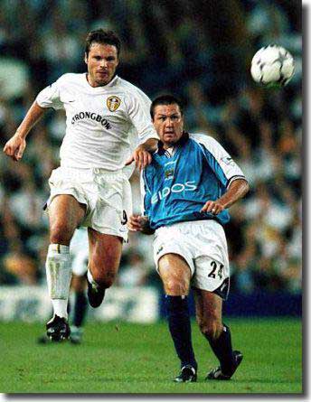 Aussie striker Mark Viduka in early season action at Elland Road against Steve Howey of Manchester City