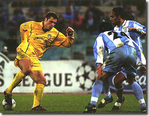 The talented Australian, Mark Viduka, drags the ball back to engineer the goal for Alan Smith