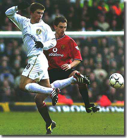 Harry Kewell shows off his party pieces against Manchester United's Gary Neville