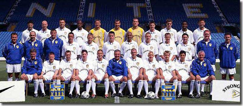 Leeds United squad 2002-03 - Back: Okon, Mills, Viduka, Duberry, Milosevic, Martyn, Robinson, Bridges, Woodgate, Radebe, Bakke. Middle: Dave Hancock (Physio), Sean Hardy (kitman), Steve Sutton (goalkeeping coach), Kelly, Batty, Harte, Dacourt, Seth Johnson, Bowyer, Keane, Roy Aitken (coach) Front: Brian Kidd (coach), Barmby, Wilcox, Fowler, Kewell, Terry Venables (manager), Matteo, Smith, McPhail, Burns, Eddie Gray (coach)