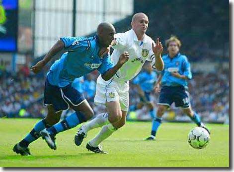 Dominic Matteo makes sure Nicolas Anelka of Manchester City doesn't get a shot on goal