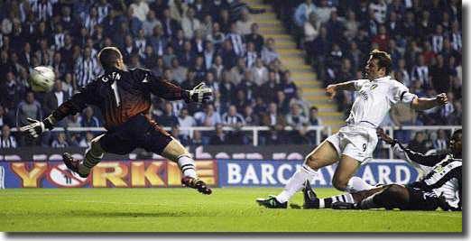 Mark Viduka scores the opening goal at Newcastle, beating keeper Shay Given