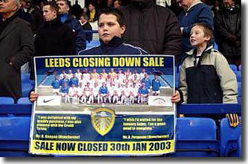 A young Leeds United fan shows his feelings after their fire sale