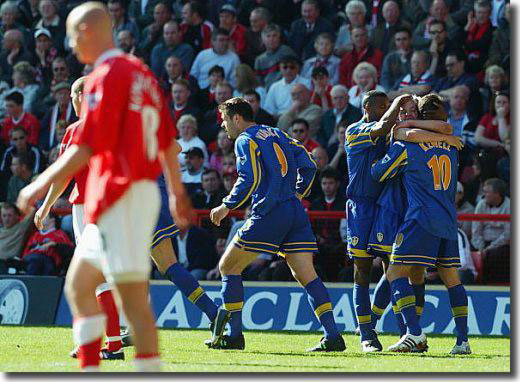 Harry Kewell is congratulated after scoring the first goal.  Viduka, Radebe and Smith are also in shot