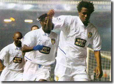 In a rare moment of triumph at Elland Road, Roque Junior celebrates his brace against Manchester United - fellow loanees Olembe and Sakho are on hand to join in