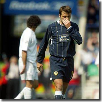 A shame-faced Mark Viduka leaves the field at Bolton after a red card 2 May 2004