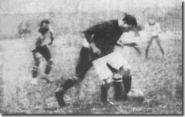 Cubberley shields the ball from a Grimsby player in December 1907 