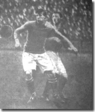 Billy Halligan charges a Birmingham defender from behind in the game on 12 February 1910 - it was the Irishman's final game for Leeds before a big money move to Derby