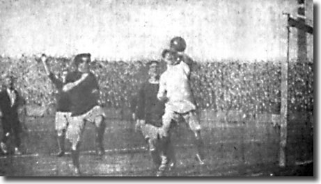 Blackpool keeper Fiske clears the ball from Mick Foley during the opening day clash against Blackpool on 3 September 1910