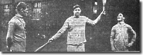 Leeds players in training for their FA Cup clash with West Bromwich Albion January 1912 - Chris Kelly swings the clubs, watched by Tony Hogg and Joe Enright