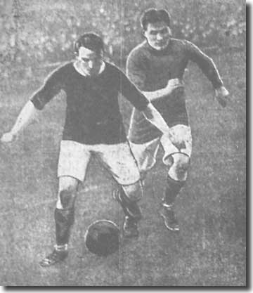 Full-back George Law shields the ball from Blackpool winger Charles during City's victory at Blackpool on New Year's Day 1913