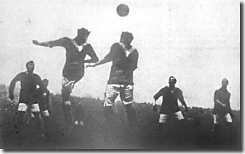 John Hampson heads clear from an Arsenal corner at Highbury on 6 December