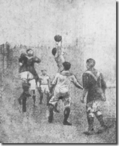 Stockport keeper Evans thwarts this City attack during the game on 3 January