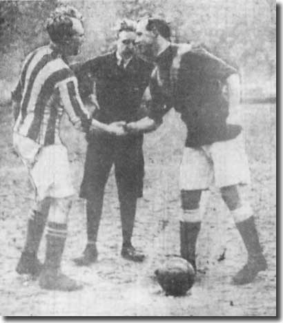 Jimmy Speirs shakes hands with West Bromwich Albion captain Jesse Pennington before the FA Cup-tie on 31 January