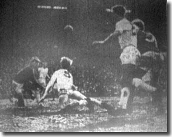 Jack Charlton dives to head clear with Sprake, Reaney and Law all watching