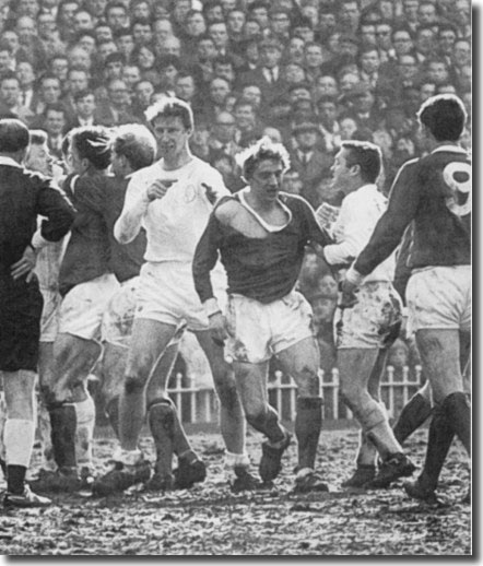 Jack Charlton, Denis Law and Bobby Collins are the main protagonists during this confrontation in the semi final clash with Manchester United