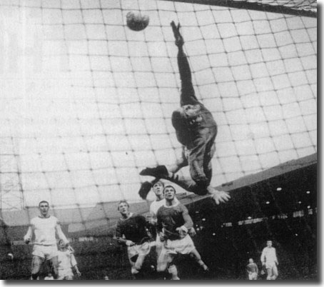 Denis Law scores his first goal in the home game with Arsenal. It was on the same night as Leeds drew 3-3 at Birmingham, and Man U's 3-1 win won them the title