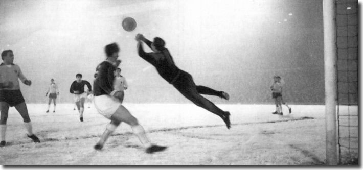 Leipzig keeper Weigang saves Bremner's goalbound effort with Jack Charlton in attendance during the first leg of the second round Fairs Cup tie