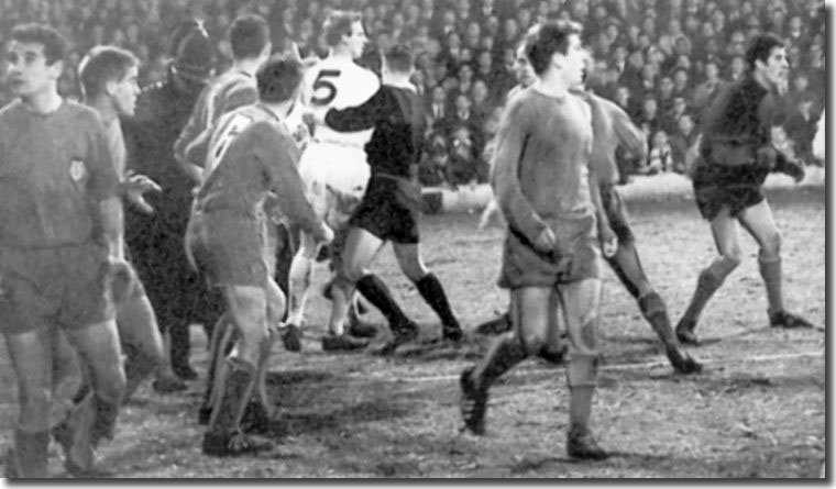 Referee Leo Horn grabs Jack Charlton during the onfield brawl against Valencia