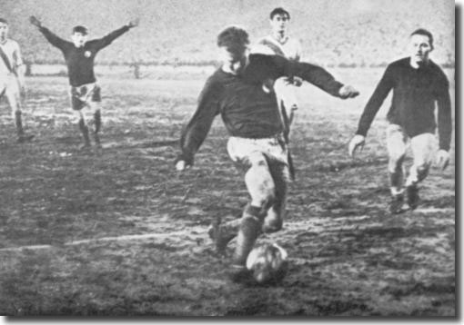 Billy Bremner slots home the fourth goal against Ujpest after rounding the keeper