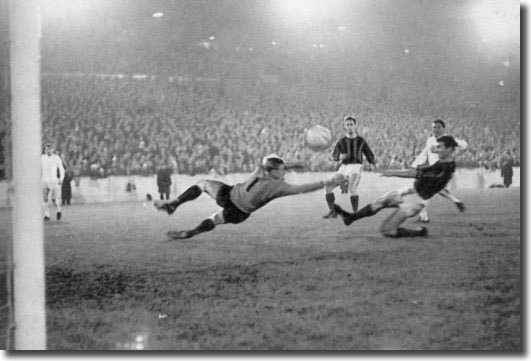 Albert Johanneson slams the ball past DWS keeper Piet Schrijvers to open the scoring at Elland Road - the South African went on to complete a hat trick as United won 5-1