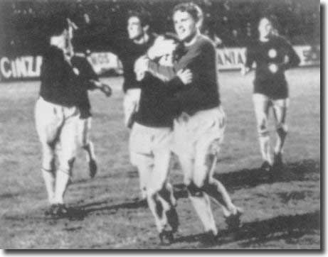 With Gary Sprake and Billy Bremner leading the way, United players celebrate victory in Valencia