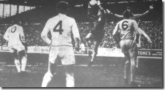 Gary Sprake takes the ball cleanly against Wolves at Elland Road on 23 December watched by Gray and Bremner