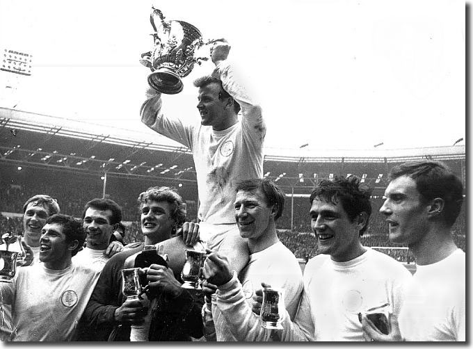 Billy Bremner held aloft by the team with the League Cup after victory over Arsenal - Greenhoff, Giles, Reaney, Sprake, Charlton, Hunter, Madeley
