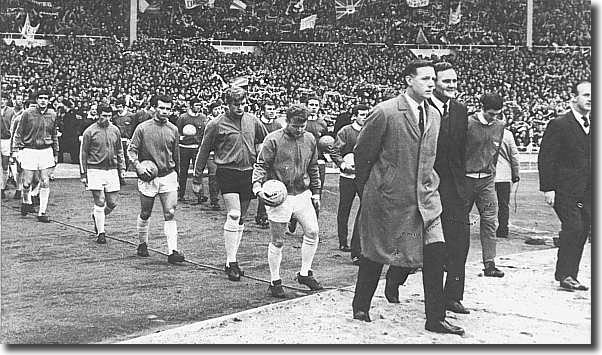 Don Revie and Bertie Mee lead out the two teams - the United players pictured are Gray, Charlton, Cooper, Hunter, Giles, Reaney, Sprake and Bremner