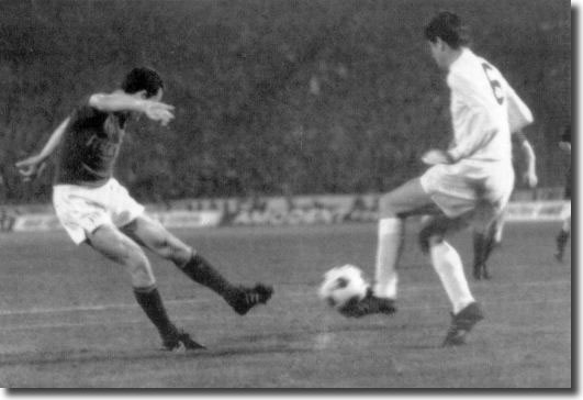 Norman Hunter blocks a shot from Hungarian star man Florian Albert