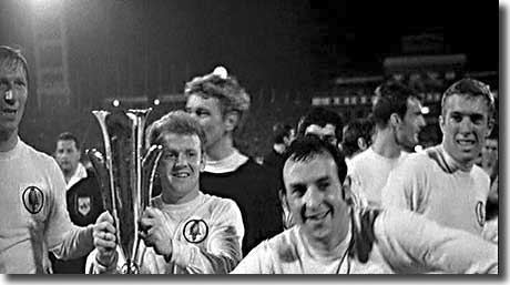 After United's Fairs Cup win in 1968, Mike O'Grady clowns it up for the camera, watched by Charlton, Bremner, Sprake and Jones