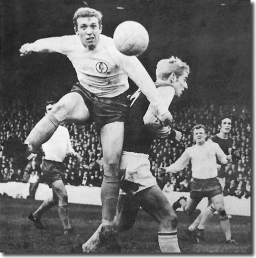 Mick Jones tangles with Burnley skipper Colin Waldron