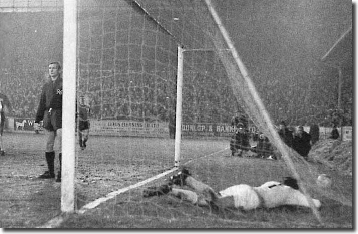 Mike O'Grady ends up in the net after scoring against Hanover