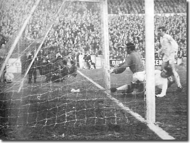 Peter Lorimer slides in to score his second goal against Burnley from close range