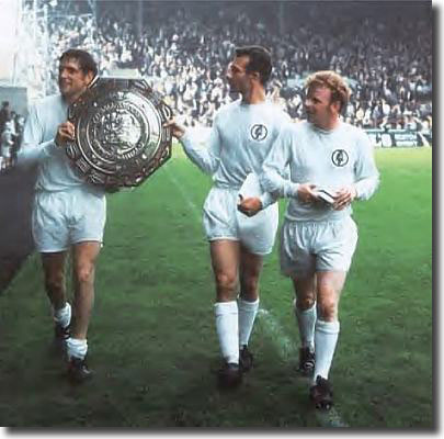 Norman Hunter, Paul Reaney and Billy Bremner show off the Charity Shield after beating Manchester City
