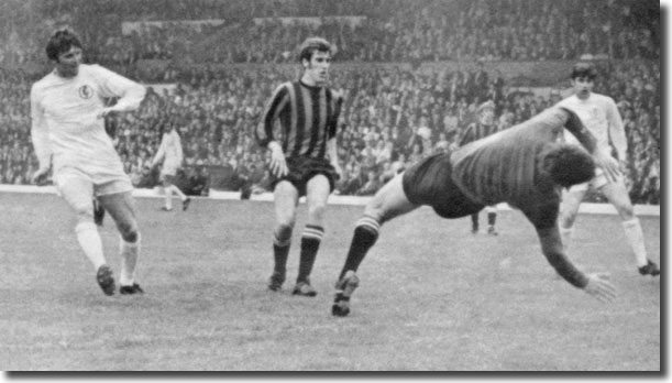 City centre-half Tommy Booth and Peter Lorimer look on as Eddie Gray shoots past Joe Corrigan to give United the lead