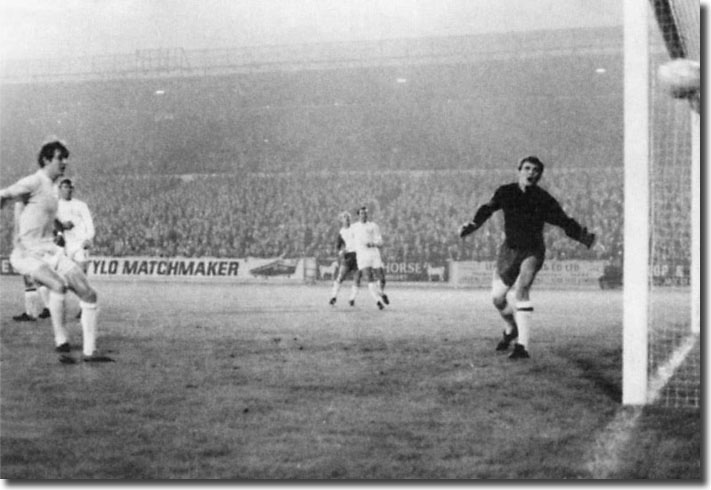 Allan Clarke looks on as Mick Jones heads his first goal