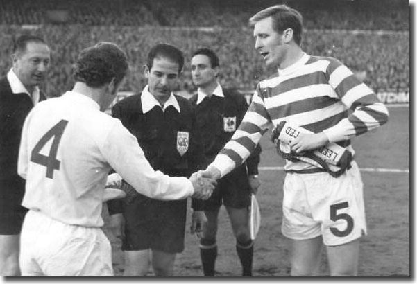 Billy Bremner shakes hands with Celtic counterpart Billy McNeill before the start of the first leg of the semi-final at Elland Road