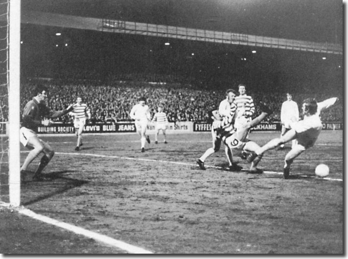 Mick Jones just fails to get in a shot with Frank Brogan beating him to the ball and Billy Bremner also in the action