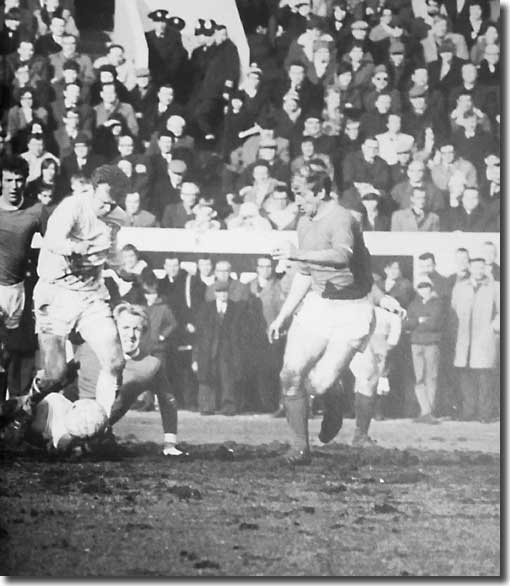 Billy Bremner in action at Old Trafford on the opening day