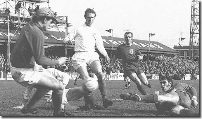 A grounded Ray Crawford flicks out a foot to put Colchester two ahead