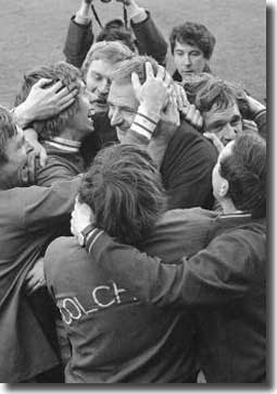 Colchester players mob manager Dick Graham after their famous defeat of Leeds