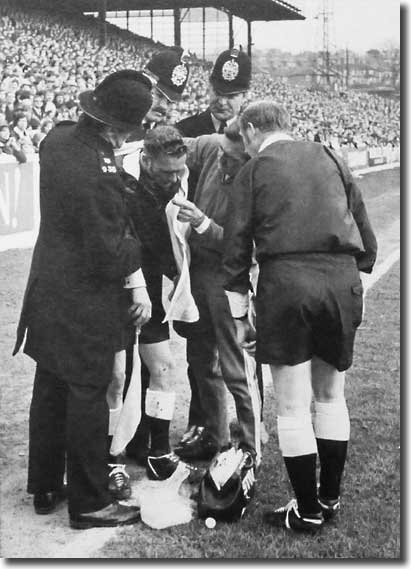 Les Cocker treats a linesman as referee Ray Tinkler and policemen look on during the controversial defeat to West Bromwich Albion in February 1971