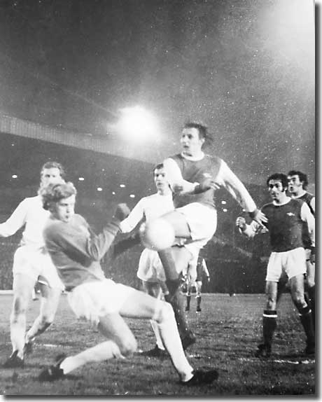 Jack Charlton, Paul Madeley, George Graham and Ray Kennedy look on as Gary Sprake denies John Radford