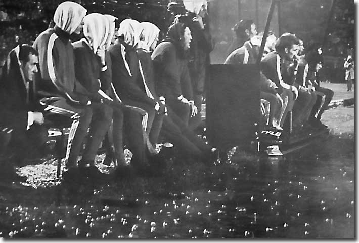 The two benches look on in the downpour during the abandoned first leg of the 1971 Fairs Cup final in Turin