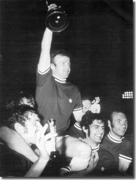 Silverware at last - Billy Bremner hoists the Fairs Cup trophy