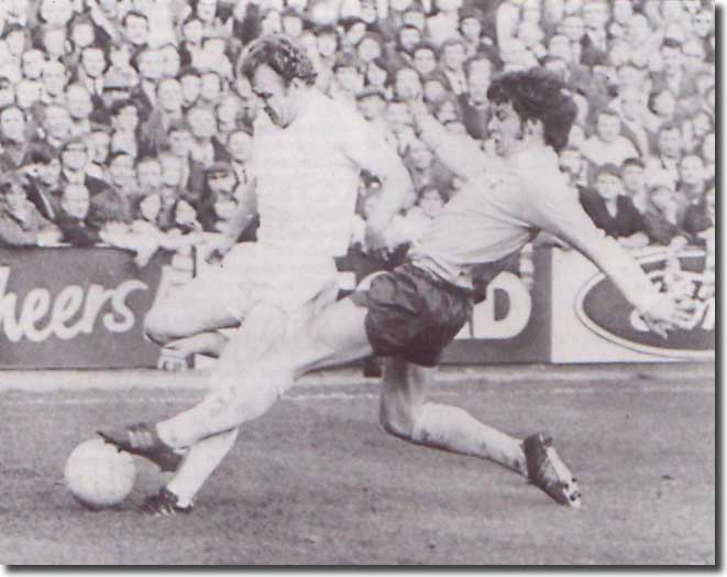 Tottenham's Cyril Knowles challenges Billy Bremner
