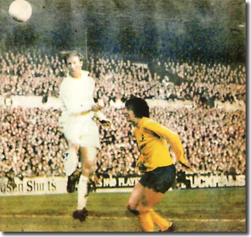 Jack Charlton soars above Cyril Knowles to head Leeds into the lead