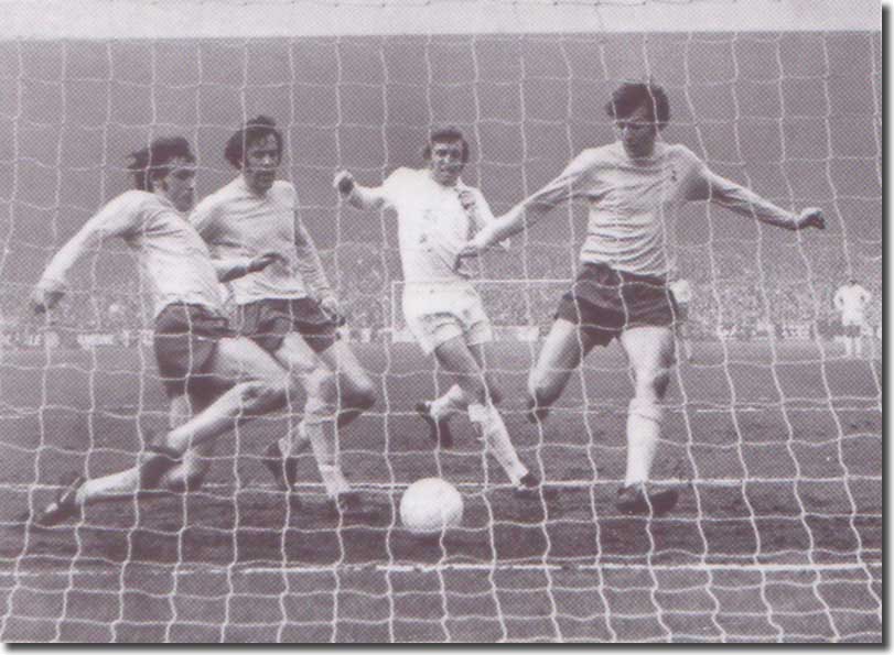 Tottenham's Evans, England and Peters combine to keep the ball out as Mick Jones moves in