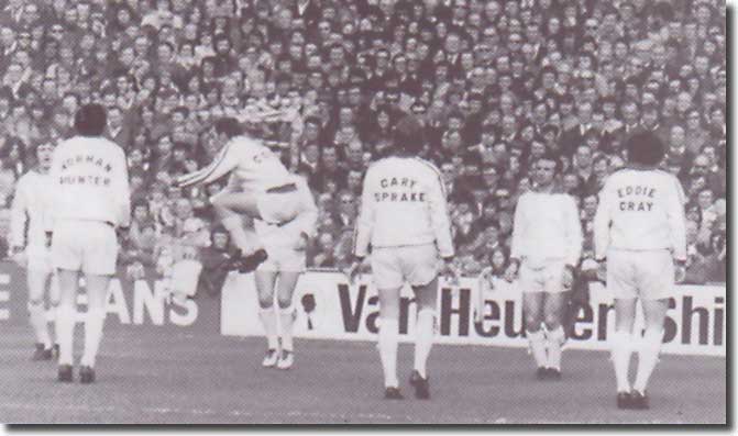 Les Cocker leads Clarke, Hunter, Cooper, Sprake, Reaney and Gray through United's new pre-match routine